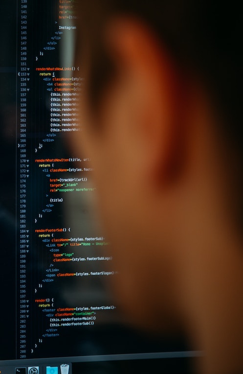 Developer looking at code on a screen